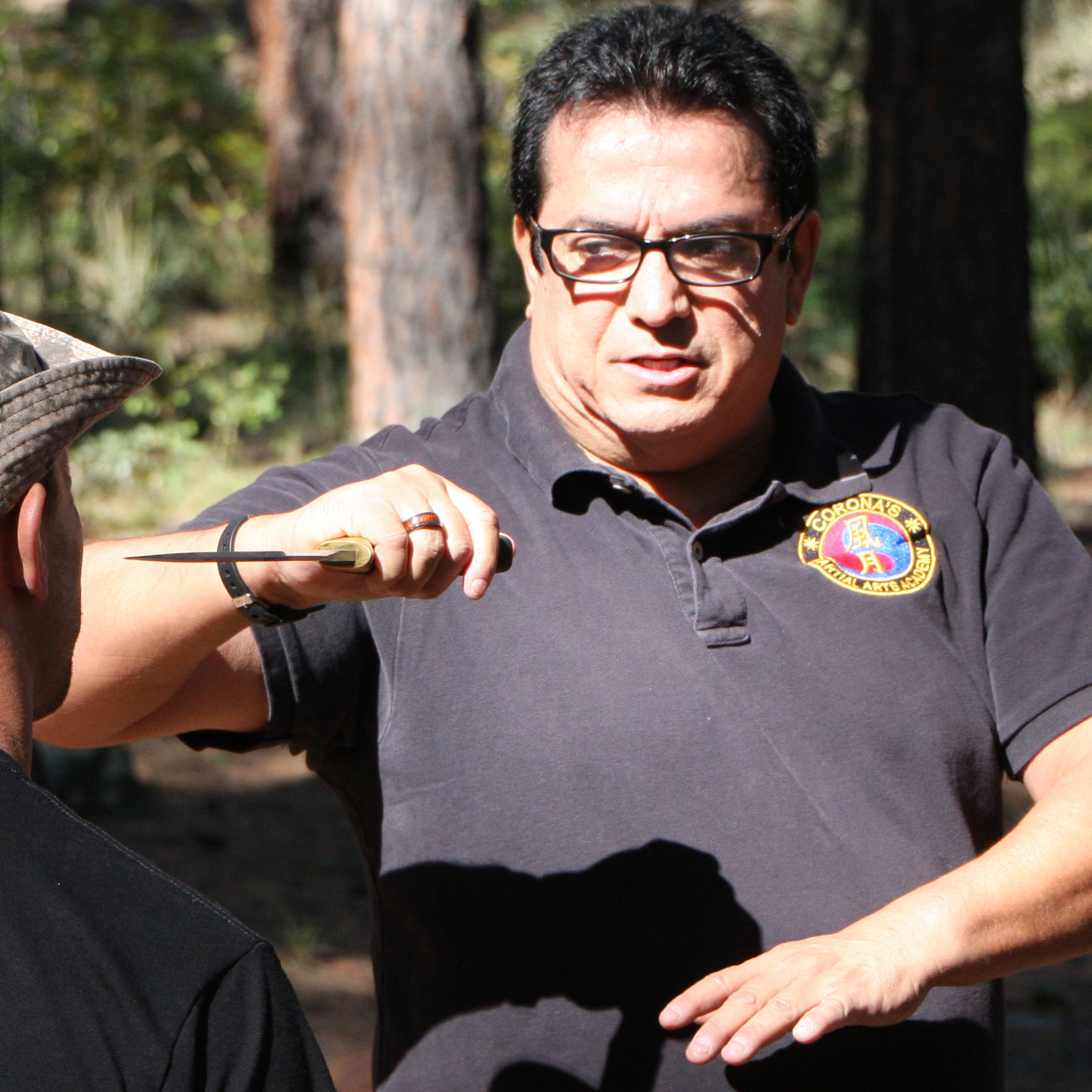 Master Corona demonstrating an instructional moment with a student